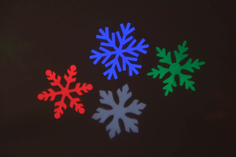 LED проектор "Новорічні декорації", проекція "Сніжинки", різнокольорові 8109